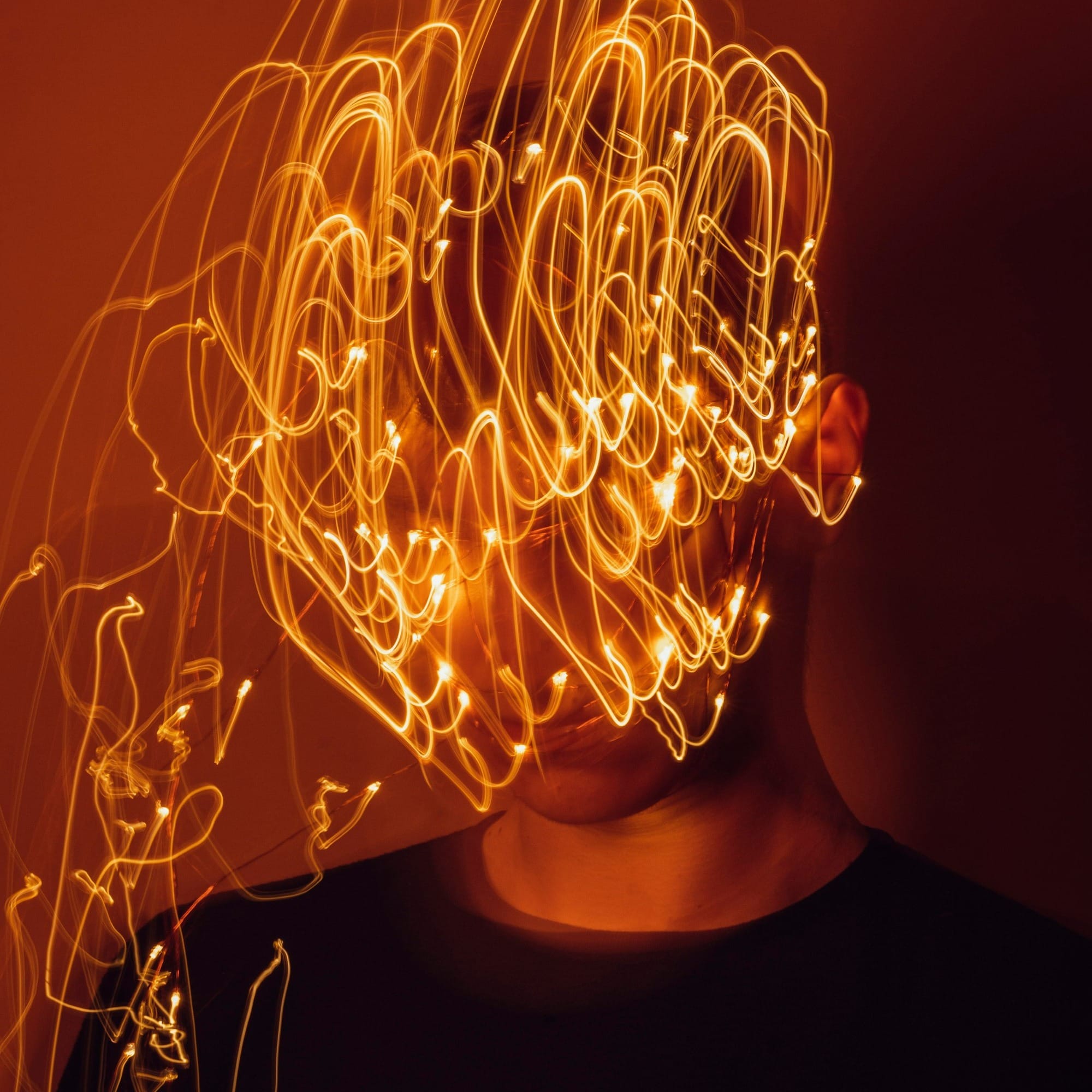 a man with a string of lights on his head